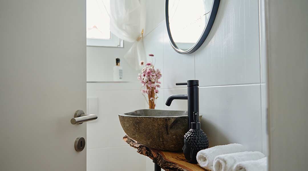 Rustic Vanity With A Stone Basin